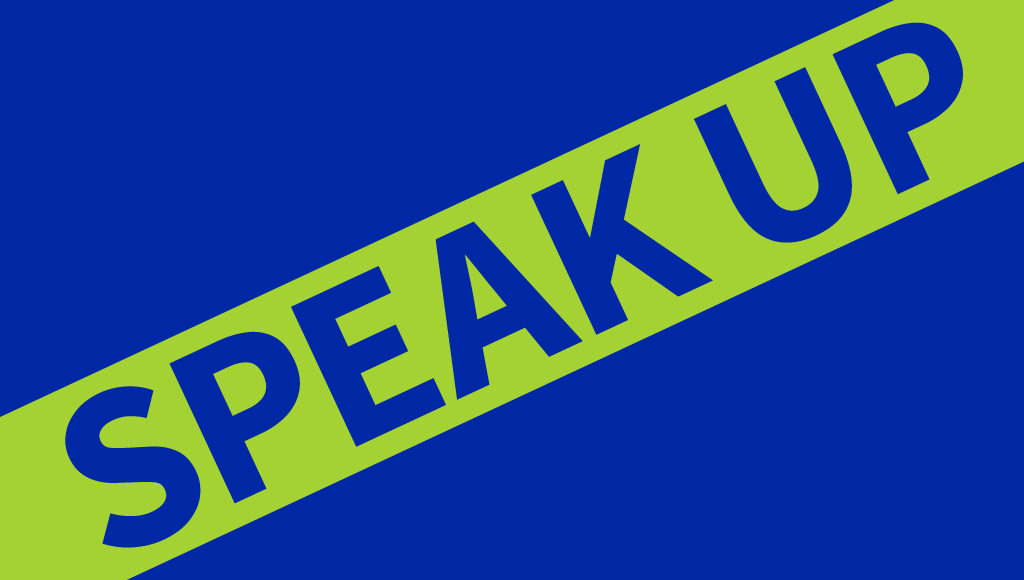 Sign reading "Speak Up!"